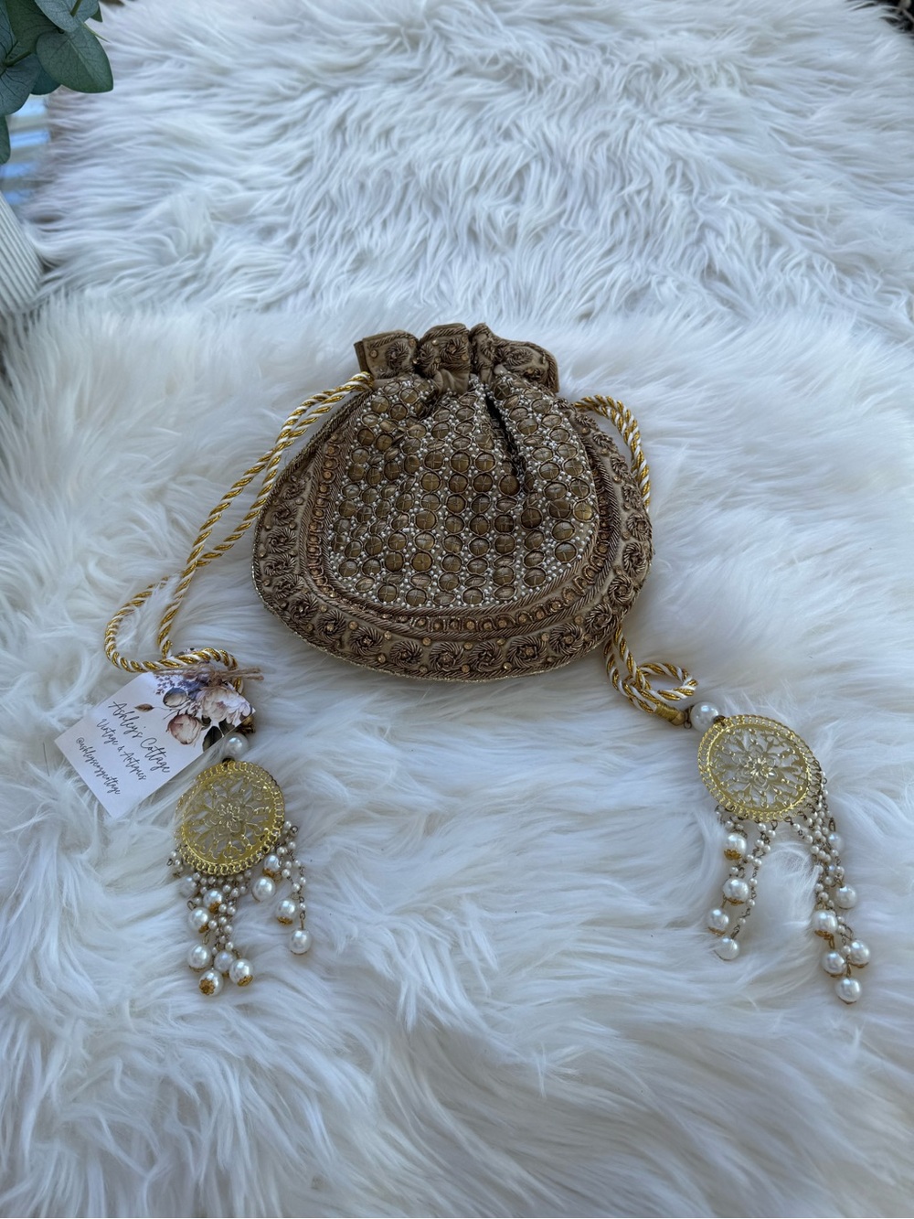 Gold Embellished Potli Clutch with Pearl Tassels
